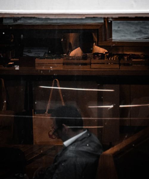 A silhouette of a person sitting peacefully against a dark background.